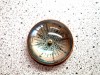 BR484409 - paper weight marine desktop compass. Antique brass, felt lining